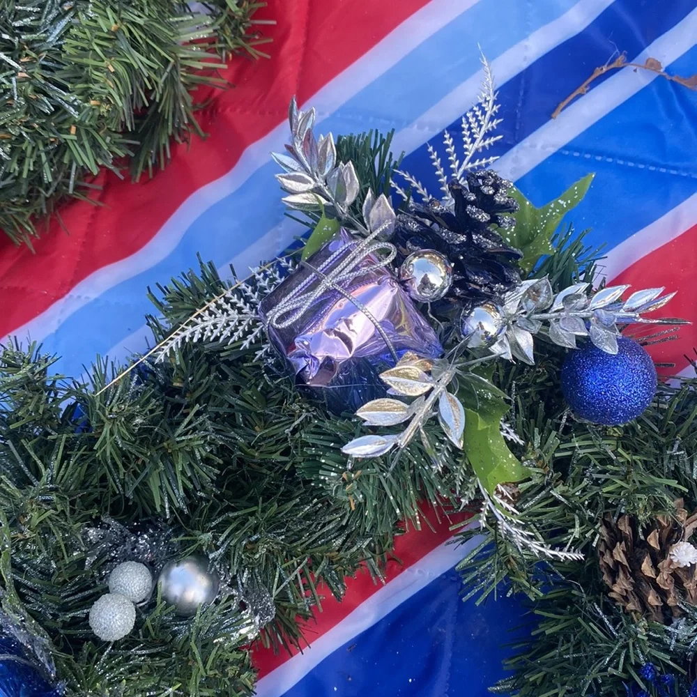 Evergreen Wreath Trimmed with silver and blue and pine ones